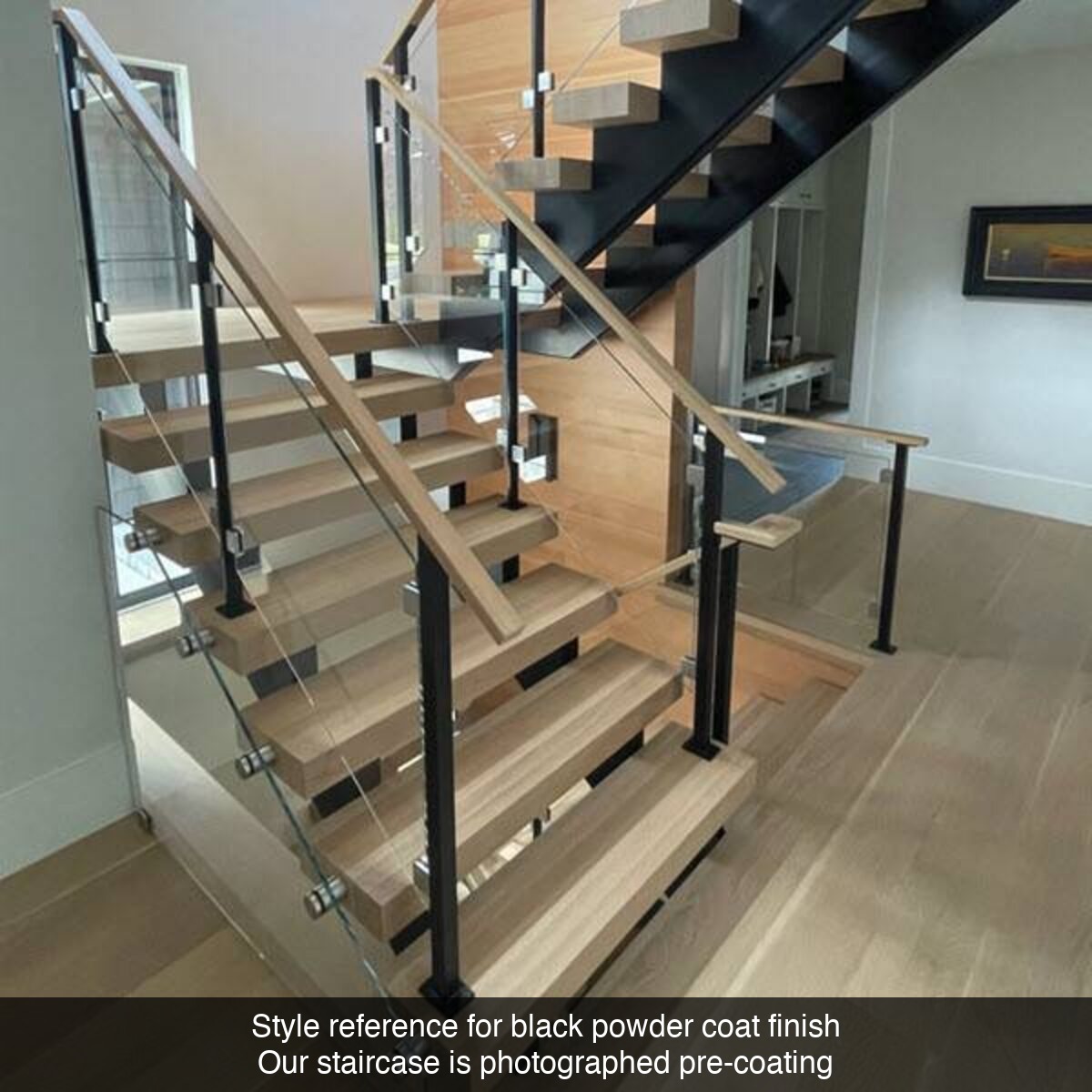 Style reference — powder coat black finish with glass railing and LED-lit treads